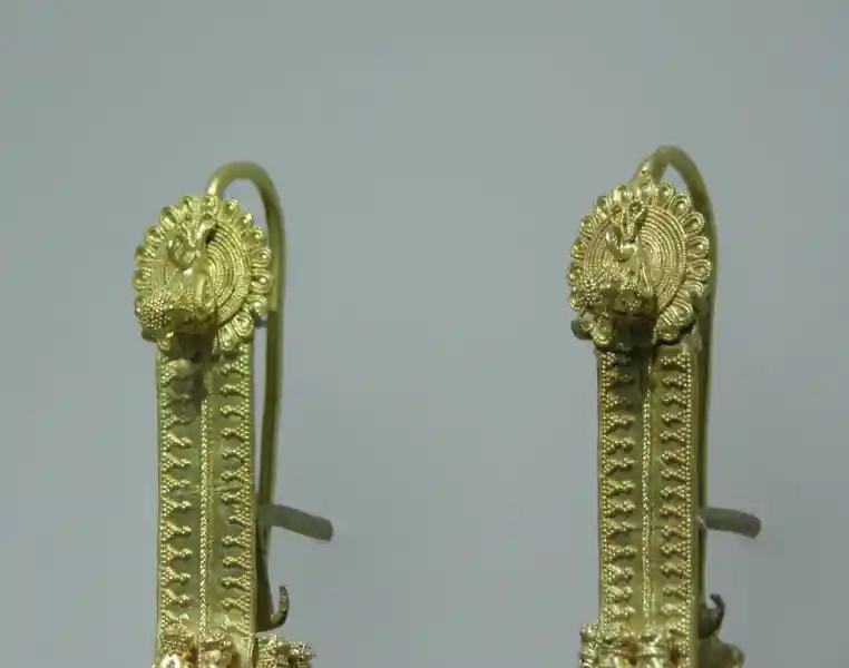 Gold pendant with winged-animal design